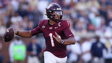 Oct 11, 2025; Atlanta, Georgia, USA; Virginia Tech Hokies quarterback Kyron Drones (1) throws a pass against the Georgia Tech Yellow Jackets in the third quarter at Bobby Dodd Stadium at Hyundai Field. Mandatory Credit: Brett Davis-Imagn Images