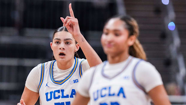 UCLA Bruins center Lauren Betts (51) points up after scoring Saturday, March 8, 2025, in a semifinals game