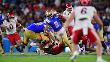 Aug 30, 2025; Pasadena, California, USA; UCLA Bruins quarterback Nico Iamaleava (9) runs the ball against the Utah Utes during the first half at Rose Bowl. Mandatory Credit: Gary A. Vasquez-Imagn Images