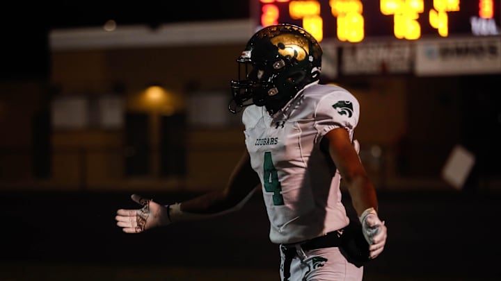 Cedar Rapids Kennedy wide receiver Cyrus Courtney (4) reacts to an over thrown ball during the game at Dragon Stadium on Friday, Oct. 14, 2022. The Johnston Dragons defeated the Cedar Rapids Kennedy Cougars, 28-7. Cedar Rapids Kennedy wide receiver Cyrus Courtney (4) reacts to an over thrown ball during the game at Dragon Stadium on Friday, Oct. 14, 2022. The Johnston Dragons defeated the Cedar Rapids Kennedy Cougars, 28-7.