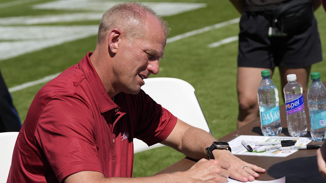 Apr 12, 2025; Tuscaloosa, AL, USA; Alabama head coach Kalen DeBoer signs autographs for fans following A-Day at Bryant-Denny Stadium. 
