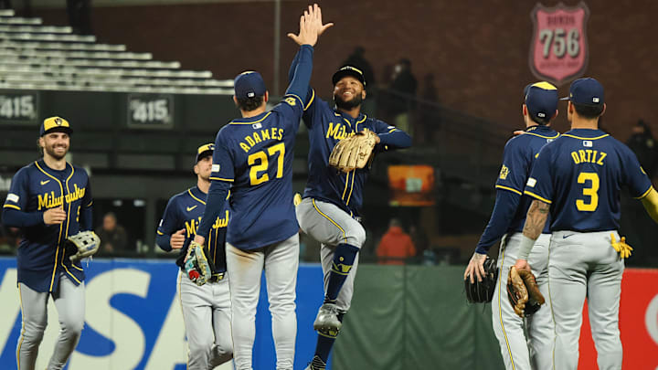 Sep 12, 2024; San Francisco, California, USA; Milwaukee Brewers left fielder Jackson Chourio (11) high fives shortstop Willy Adames (27) after a win against the San Francisco Giants at Oracle Park. Mandatory Credit: Kelley L Cox-Imagn Images