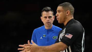 Apr 5, 2025; San Antonio, TX, USA; Florida Gatorshead coach Todd Golden talks with NCAA referee Courtney Green during the second half in the semifinals of the men's Final Four of the 2025 NCAA Tournament at the Alamodome. Mandatory Credit: Bob Donnan-Imagn Images