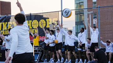 The Iowa men’s basketball team reacts after a halfcourt shot is made during the Hawkeye Hoops from Downtown event Oct. 17, 2025 on the University of Iowa campus in Iowa City, Iowa.