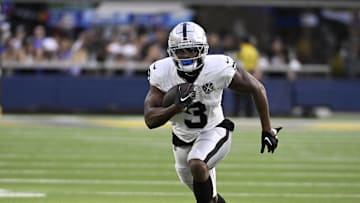 Oct 20, 2024; Inglewood, California, USA; Las Vegas Raiders running back Zamir White (3) runs after a catch against the Los Angeles Rams during the second half at SoFi Stadium. Mandatory Credit: Alex Gallardo-Imagn Images