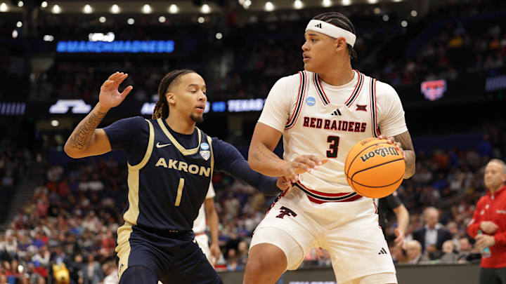 Mar 20, 2026; Tampa, FL, USA; Texas Tech Red Raiders forward Lejuan Watts (3) drives against Akron Zips guard Shammah Scott (1) in the second half during a first round game of the men's 2026 NCAA Tournament at Benchmark International Arena. Mandatory Credit: Nathan Ray Seebeck-Imagn Images