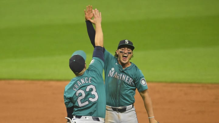 Seattle Mariners first baseman Ty France (23) and third baseman Josh Rojas (4) celebrate a win over the Cleveland Guardians at Progressive Field on June 18.