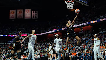 Sep 1, 2025; Uncasville, Connecticut, USA; Connecticut Sun guard Leila Lacan (47) scores against  Atlanta Dream guard Maya Caldwell (33) in the second half at Mohegan Sun Arena.