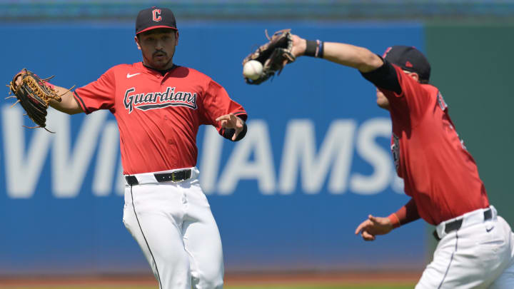 Aug 26, 2024; Cleveland, Ohio, USA; Cleveland Guardians left fielder Steven Kwan, left, watches as shortstop Tyler Freeman (2) can not make the catch on a ball hit by Kansas City Royals first baseman Vinnie Pasquantino (not pictured) during the fourth inning at Progressive Field. Mandatory Credit: Ken Blaze-USA TODAY Sports