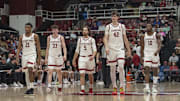 Feb 26, 2025; Stanford, California, USA;  Stanford Cardinal guard Jaylen Blakes (21), forward Evan Stinson (33) , guard Benny Gealer (5), forward Maxime Raynaud (42) and forward Chisom Okpara (10) walk back onto the court during the second half against the Boston College Eagles at Maples Pavilion. Mandatory Credit: Stan Szeto-Imagn Images