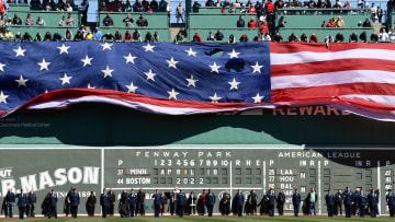 Apr 18, 2022; Boston, Massachusetts, USA; An American Flag is displayed over the Green Monster