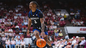 Nov 4, 2024; Tuscaloosa, Alabama, USA; North Carolina-Asheville Bulldogs guard Jordan Marsh (2) drives the ball down the court against the Alabama Crimson Tide during the second half at Coleman Coliseum. Mandatory Credit: Will McLelland-Imagn Images
