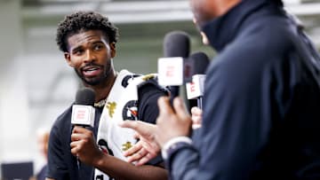 Apr 4, 2025; Boulder, CO, USA; Colorado Buffaloes quarterback Shedeur Sanders (2) talks to ESPN after the University of Colorado NFL Showcase at the CU Indoor Practice Facility. Mandatory Credit: Michael Ciaglo-Imagn Images