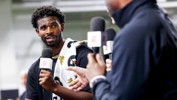 Apr 4, 2025; Boulder, CO, USA; Colorado Buffaloes quarterback Shedeur Sanders (2) talks to ESPN after the University of Colorado NFL Showcase at the CU Indoor Practice Facility. Mandatory Credit: Michael Ciaglo-Imagn Images