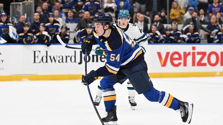 Mar 26, 2026; St. Louis, Missouri, USA; St. Louis Blues right wing Dalibor Dvorsky (54) takes a shot against the San Jose Sharks in overtime at Enterprise Center. Mandatory Credit: Joe Puetz-Imagn Images