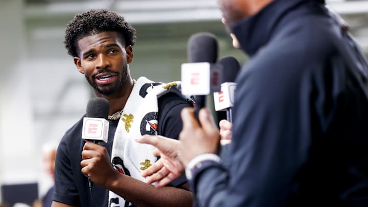 Apr 4, 2025; Boulder, CO, USA; Colorado Buffaloes quarterback Shedeur Sanders (2) talks to ESPN after the University of Colorado NFL Showcase at the CU Indoor Practice Facility. Mandatory Credit: Michael Ciaglo-Imagn Images