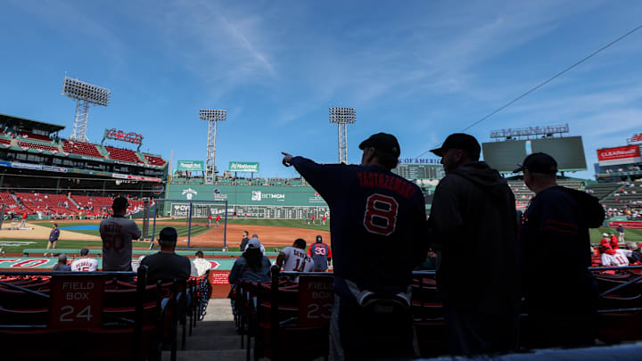 Boston, Massachusetts, USA; Boston Red Sox fans watch batting practice before a game against the St. Louis Cardinals at Fenway Park. Boston, Massachusetts, USA; Boston Red Sox fans watch batting practice before a game against the St. Louis Cardinals at Fenway Park.