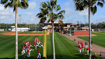 Feb 12, 2025; Clearwater, FL, USA;  Members of the Philadelphia Phillies warm up during spring training at Carpenter Complex