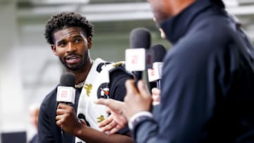 Apr 4, 2025; Boulder, CO, USA; Colorado Buffaloes quarterback Shedeur Sanders (2) talks to ESPN after the University of Colorado NFL Showcase at the CU Indoor Practice Facility. Mandatory Credit: Michael Ciaglo-Imagn Images