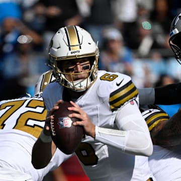 Nov 9, 2025; Charlotte, North Carolina, USA;  New Orleans Saints quarterback Tyler Shough (6) with the ball as Carolina Panthers defensive end Derrick Brown (95) pressures in the first quarter at Bank of America Stadium. Mandatory Credit: Bob Donnan-Imagn Images