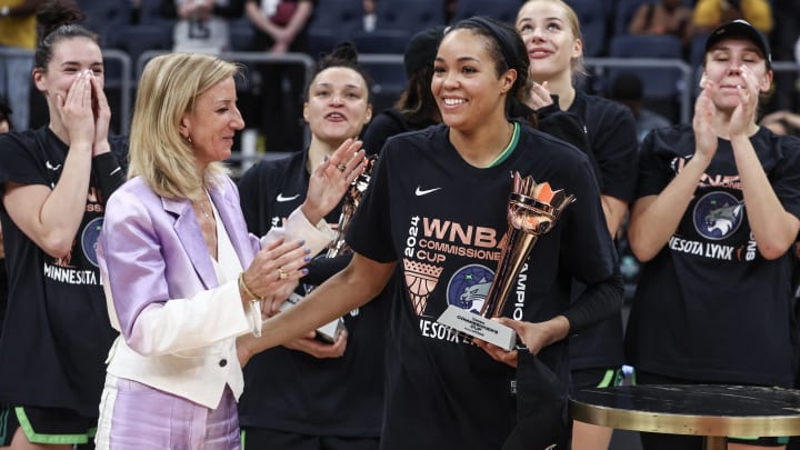 WNBA Commissioner Cathy Englebert gives the WNBA Commissioner’s Cup Championship MVP award to Minnesota Lynx forward Napheesa Collier.