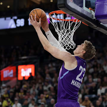 Feb 12, 2025; Salt Lake City, Utah, USA;  Utah Jazz forward Lauri Markkanen (23) dunks during the second half against the Los Angeles Lakers at Delta Center. Mandatory Credit: Chris Nicoll-Imagn Images