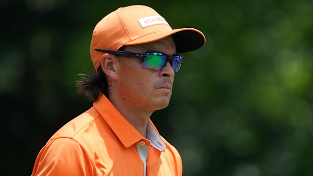Rickie Fowler walks down the sixth fairway during the final round of the Charles Schwab Challenge golf tournament.