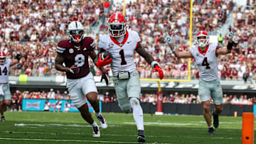 Nov 8, 2025; Starkville, Mississippi, USA; Georgia Bulldogs wide receiver Zachariah Branch (1) runs with the ball for a touchdown against the Mississippi State Bulldogs during the first half at Davis Wade Stadium at Scott Field. Mandatory Credit: Wesley Hale-Imagn Images