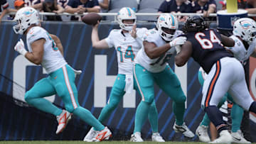 Aug 10, 2025; Chicago, Illinois, USA; Miami Dolphins quarterback Quinn Ewers (14) passes the ball against the Chicago Bears during the second half at Soldier Field. Mandatory Credit: David Banks-Imagn Images