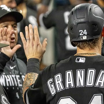 Chicago White Sox catcher Yasmani Grandal (24) scores in the eighth inning against the Detroit Tigers at Comerica Park in 2023.
