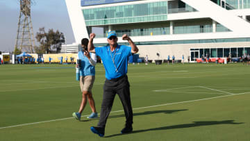 Jul 24, 2024; El Segundo, CA, USA;  Los Angeles Chargers head coach Jim Harbaugh reacts with fans prior to the first day of training camp at The Bolt. Mandatory Credit: Kiyoshi Mio-USA TODAY Sports