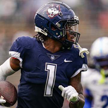 Sep 28, 2024; East Hartford, Connecticut, USA; Connecticut Huskies wide receiver Skyler Bell (1) makes the touchdown catch against the Buffalo Bulls in the second quarter at Rentschler Field at Pratt & Whitney Stadium. Mandatory Credit: David Butler II-Imagn Images