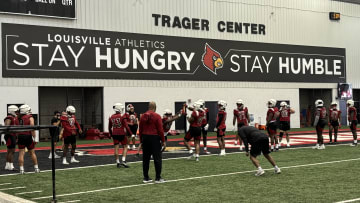 Louisville defensive lineman practice during the first day of fall camp.