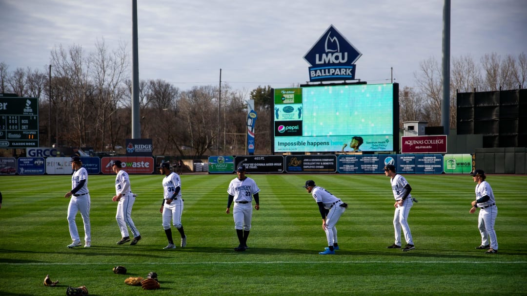 The West Michigan Whitecaps warm up ahead of their season opener against the Lansing Lugnuts