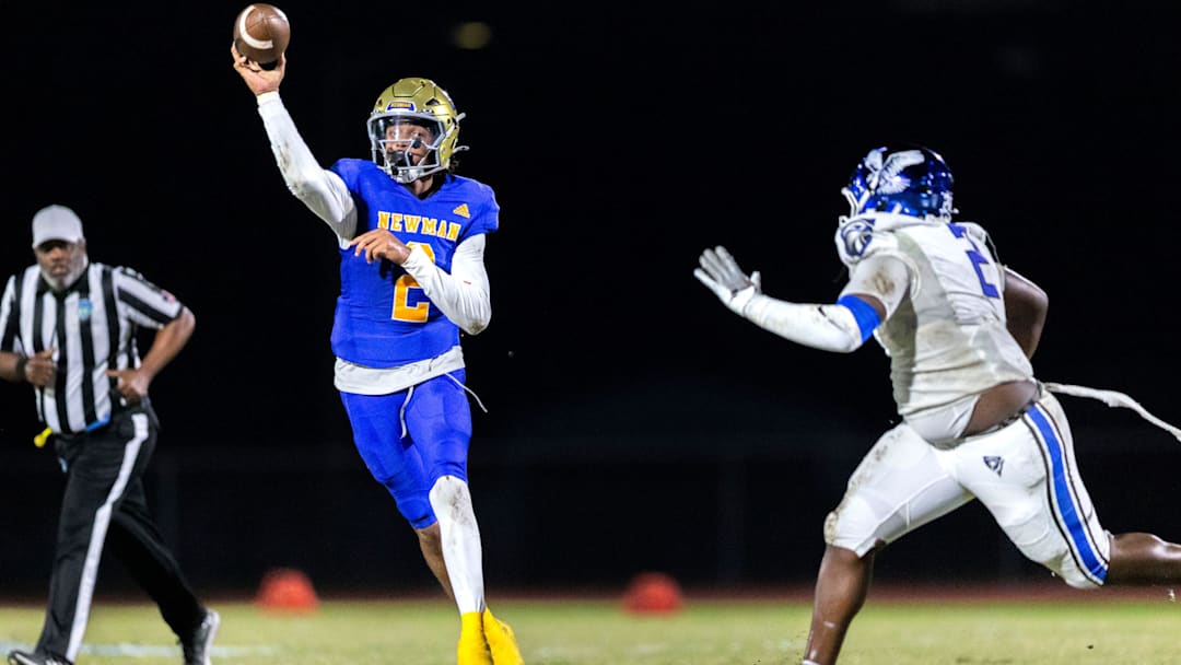 Cardinal Newman quarterback Jyron Hughley passes the ball against Community School of Naples 45-14 during their playoff game on November 21, 2025, in West Palm Beach, Florida.