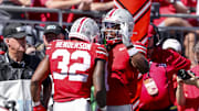 Sep 21, 2024; Columbus, Ohio, USA; Ohio State Buckeyes running back TreVeyon Henderson (32) celebrates the touchdown with running back Quinshon Judkins (1) during the second quarter against the Marshall Thundering Herd at Ohio Stadium. Mandatory Credit: Joseph Maiorana-Imagn Images