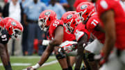 Georgia offensive lineman Jared Wilson (55) gets set to snap the ball during the G-Day spring football game in Athens, Ga., on Saturday, April 16, 2022. The black team won 26-23.

Syndication Online Athens