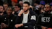 Mar 1, 2023; New York, New York, USA; Brooklyn Nets injured guard Ben Simmons (10) watches from the bench during the third quarter against the New York Knicks at Madison Square Garden. Mandatory Credit: Brad Penner-Imagn Images