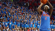 Feb 1, 2025; Oxford, Mississippi, USA; Mississippi Rebels fans hold up their hands as Mississippi Rebels guard Jaylen Murray (5) shoots a free throw during the second half against the Auburn Tigers at The Sandy and John Black Pavilion at Ole Miss. Mandatory Credit: Petre Thomas-Imagn Images