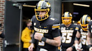 Nov 8, 2025; Columbia, Missouri, USA; Missouri Tigers quarterback Matt Zollers runs out of the tunnel ahead of the Missouri matchup against Texas A&M at Faurot Field.