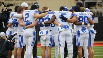 The team huddles together as they prepare for Oklahoma State