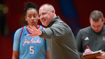 Kansas coach Brandon Schneider talks with players during a timeout in the second half of the game against Iowa State Wednesday, Jan. 24, 2024, inside Allen Fieldhouse