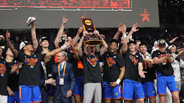 Apr 7, 2025; San Antonio, TX, USA;  Florida Gators players hoist the trophy after defeating the Houston Cougars in the national championship game of the Final Four of the 2025 NCAA Tournament at the Alamodome. Mandatory Credit: Robert Deutsch-Imagn Images