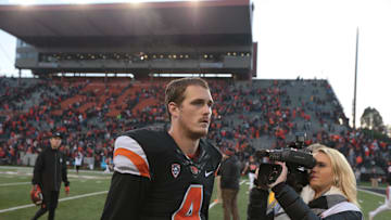 Nov 8, 2014; Corvallis, OR, USA; Oregon State Beavers quarterback Sean Mannion (4) walks off the field following a 32-39 defeat by the Washington State Cougars at Reser Stadium. Mandatory Credit: Scott Olmos-Imagn Images