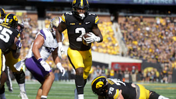 Iowa’s Kaleb Johnson (2) runs to the endzone to score against Washington Saturday, Oct. 12, 2024 at Kinnick Stadium in Iowa City, Iowa.