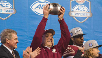 Dec 6, 2014; Charlotte, NC, USA; Florida State Seminoles head coach Jimbo Fisher holds up the ACC trophy after defeating the Georgia Tech Yellow Jackets at Bank of America Stadium. FSU defeated Georgia Tech 37-35. Mandatory Credit: Jeremy Brevard-Imagn Images