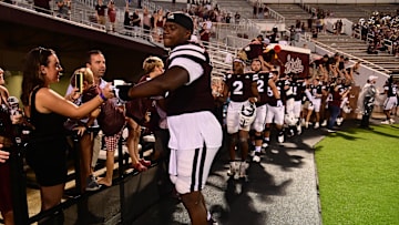 Aug 31, 2024; Starkville, Mississippi, USA; Mississippi State Bulldogs players react with fans after defeating the Eastern Kentucky Colonels at Davis Wade Stadium at Scott Field. Mandatory Credit: Matt Bush-Imagn Images