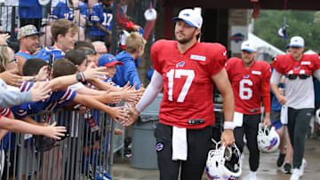Bills quarterback Josh Allen leads the quarterbacks onto the field, high-fiving fans as they go, during day seven of Buffalo Bills training camp at St. John Fisher University Thursday, July 31, 2025 in Pittsford, NY.