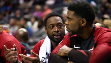 Oct 30, 2018; Charlotte, NC, USA; Miami Heat guard Dwayne Wade (3) talks with forward Udonis Haslem (40) on the bench in the 4th quarter against the Charlotte Hornets at Spectrum Center. Mandatory Credit: Jeremy Brevard-USA TODAY Sports