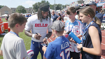 Bills running back James Cook signs autographs for fans during day five of Buffalo Bills training camp.